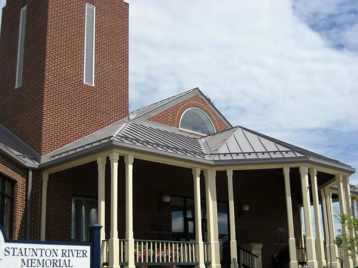 Skilled roofing craftsmen working on a residential roof in Rochester Mills